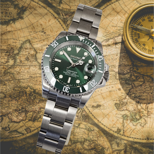 Silver Seiko watch with green face on an old world map background