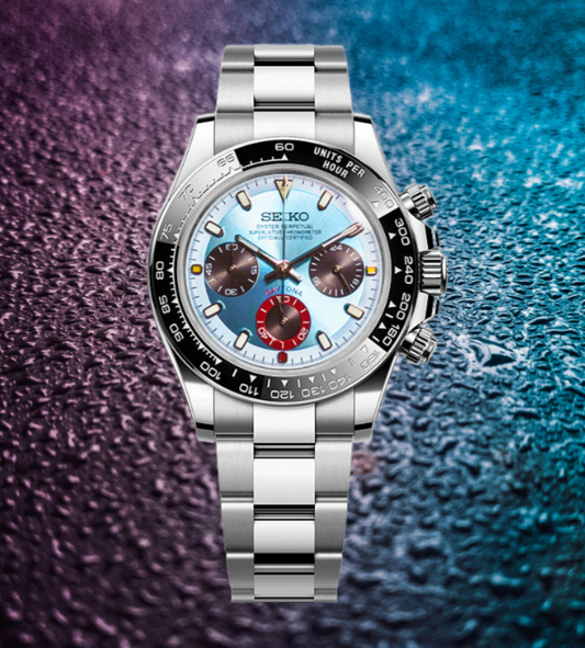 Silver Seiko watch with a multicolored face on a textured purple and blue background