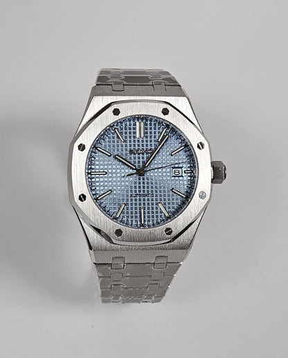 A silver-toned Royal Oak Seiko Mod watch with a sky blue dial and a stainless steel bracelet.