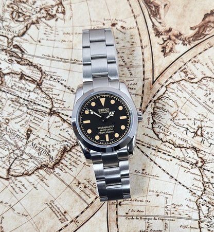 Silver Seiko watch on an old map background