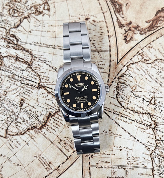 Silver Seiko watch on an old map background