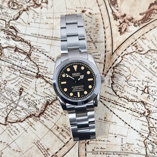 Silver Seiko watch on an old map background