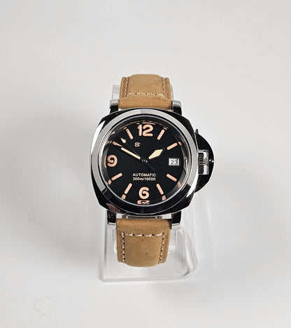 Watch with brown leather strap on a white background