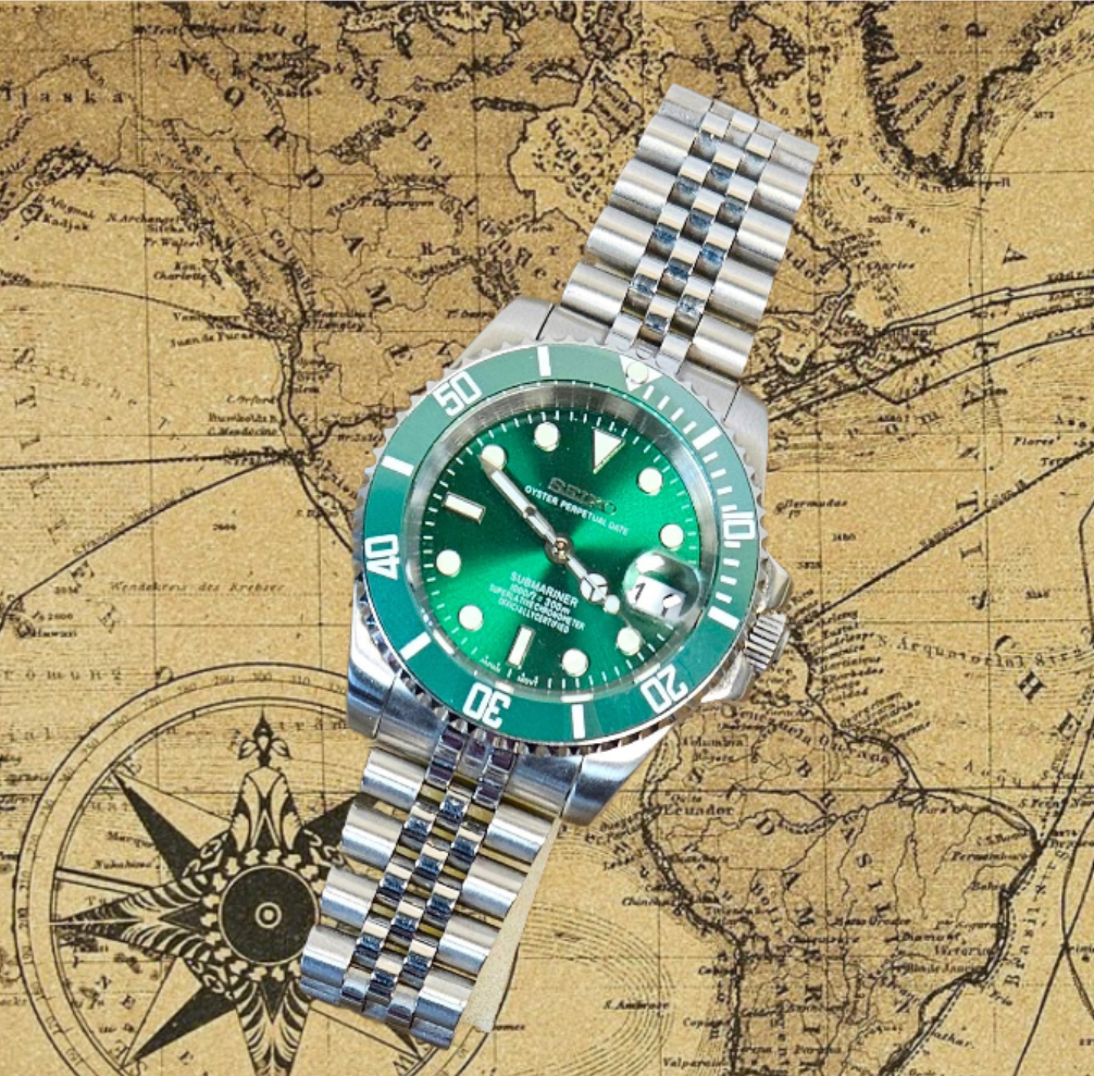 Green watch with silver bracelet on a vintage map background